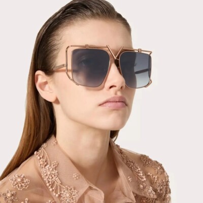 Woman wearing oversized Valentino sunglasses