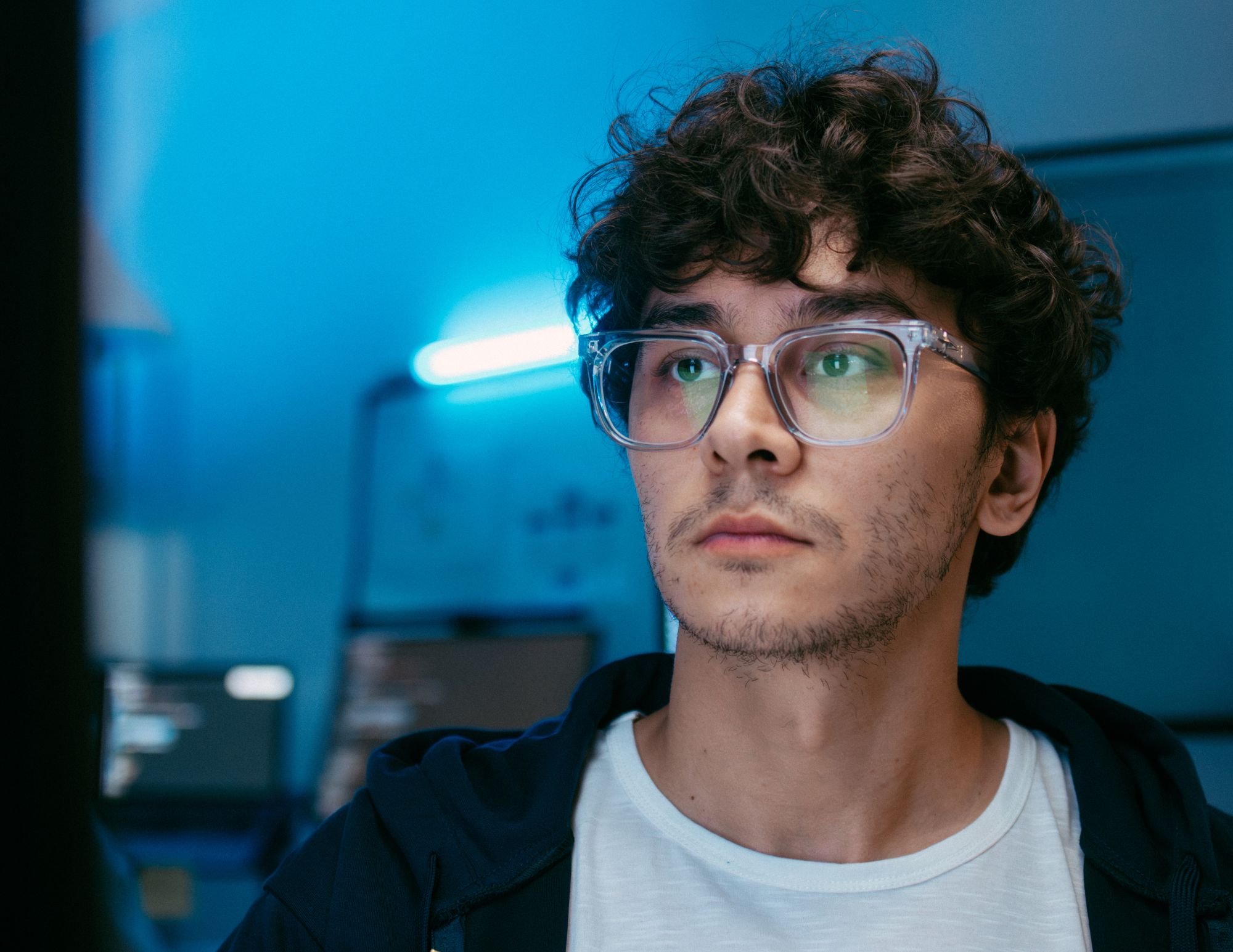 Young man wearing blue light lenses from Mango Optic in Boca Raton