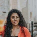 Woman wearing glasses from Mango Optic in Boca Raton.