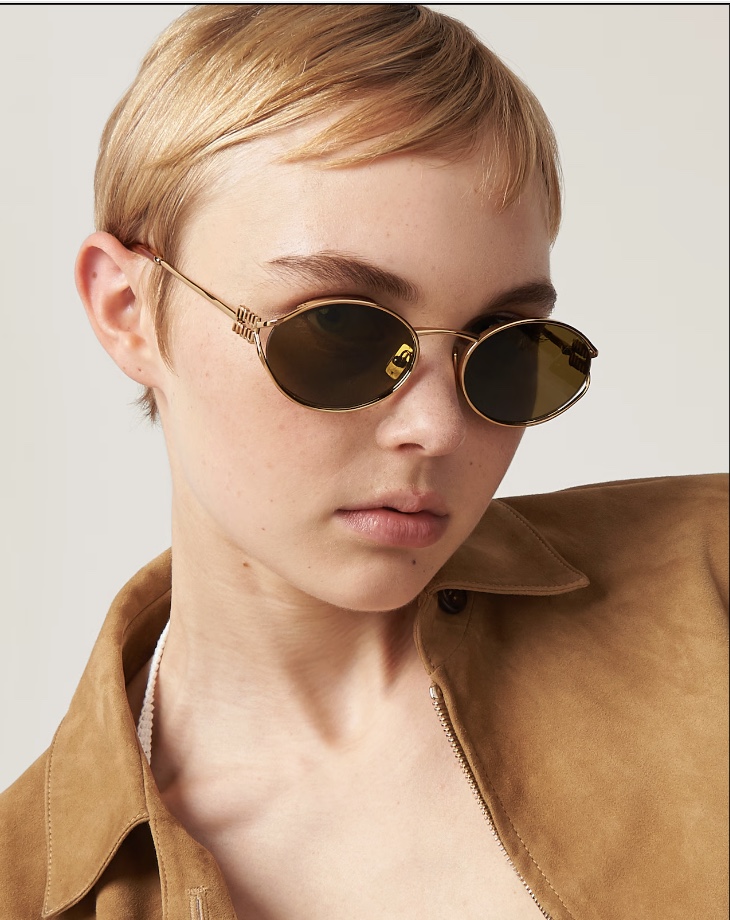 Woman wearing Miu Miu sunglasses from Mango Optic in Boca Raton.