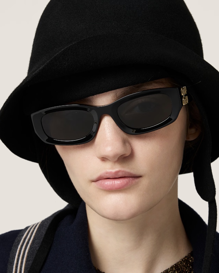 Woman wearing Miu Miu sunglasses from Mango Optic in Boca Raton.