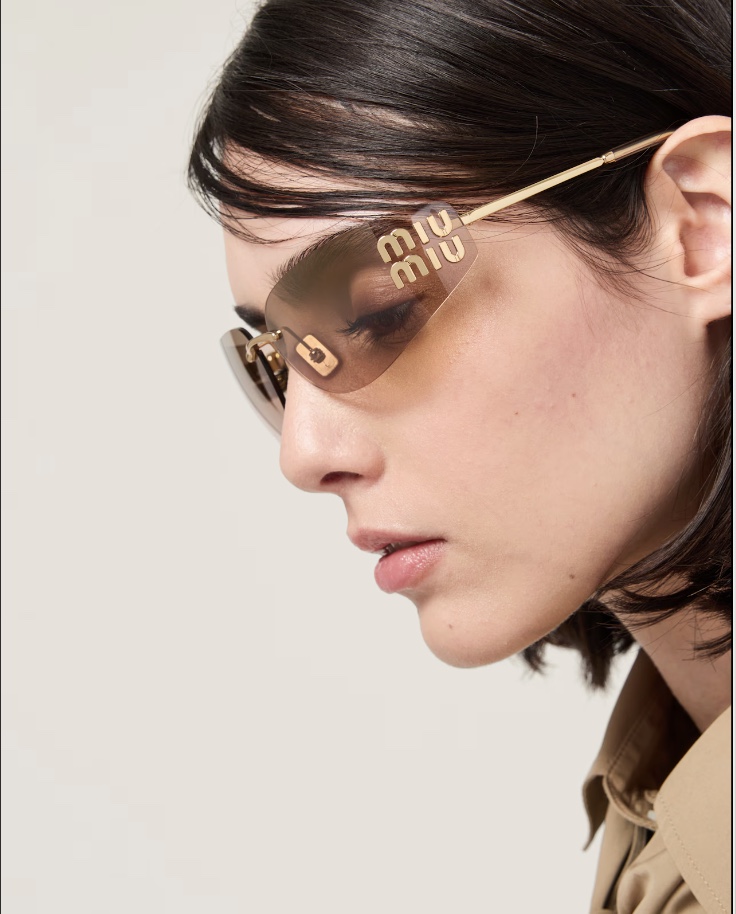 Woman wearing Miu Miu sunglasses from Mango Optic in Boca Raton.