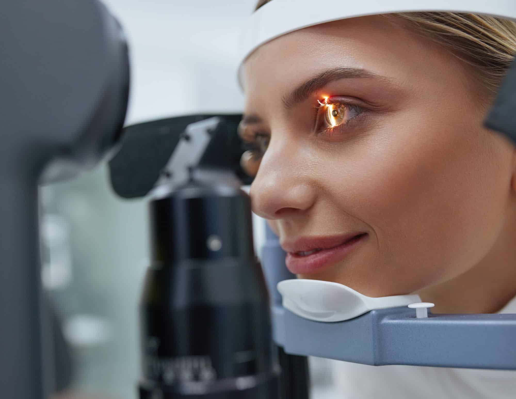 Woman getting an eye exam from Mango Optic.